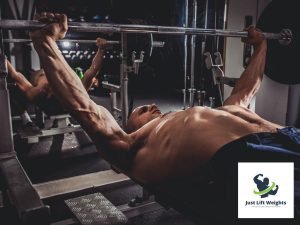 guy doing chest press with barbell